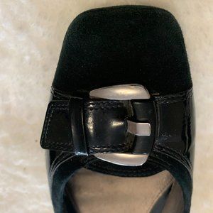 Black suede ballerina flats with patent leather accent and a silver buckle. Size